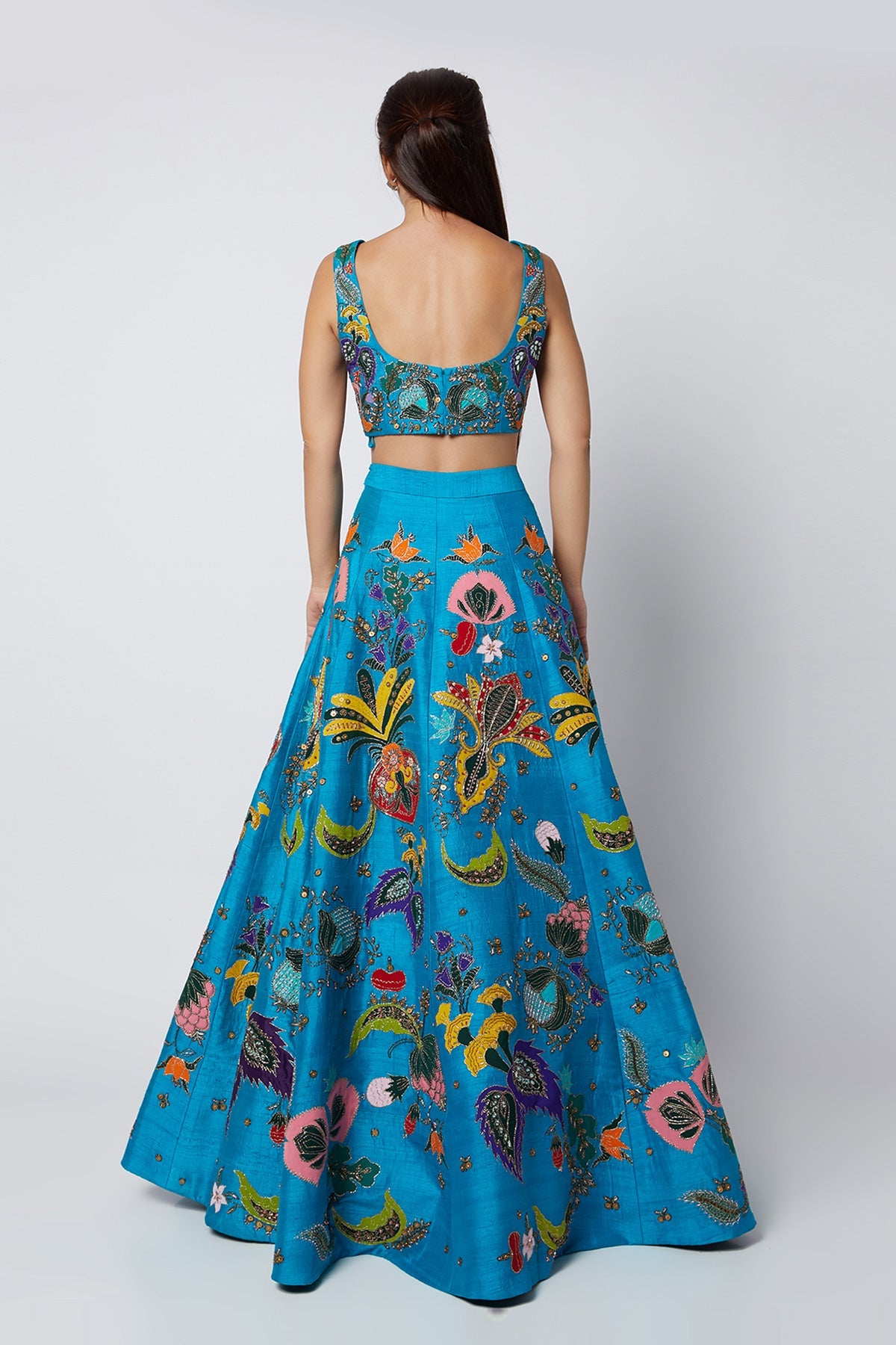 KAIRA - Cyan Blue Nadenka Raw Silk Appliquéd And Embellished Lehenga With Blouse And Cutwork Tulle Dupatta