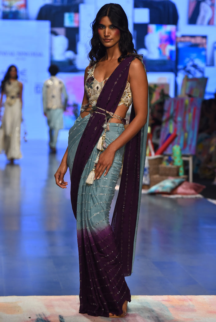 NIYA OFF WHITE GEORGETTE EMBROIDERED CHOLI WITH POWDER BLUE AND PURPLE GEORGETTE SEQUINS SAREE