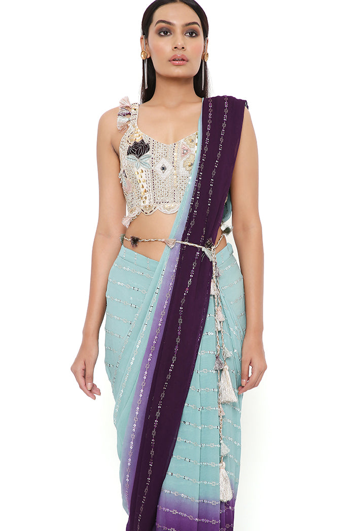 NIYA OFF WHITE GEORGETTE EMBROIDERED CHOLI WITH POWDER BLUE AND PURPLE GEORGETTE SEQUINS SAREE