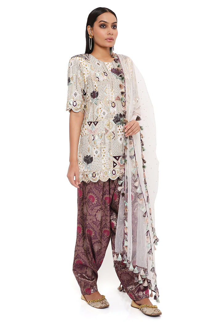 OFF WHITE GEORGETTE EMBROIDERED KURTA WITH PURPLE BROCADE SALWAR AND OFF WHITE MUKAISH NET DUPATTA