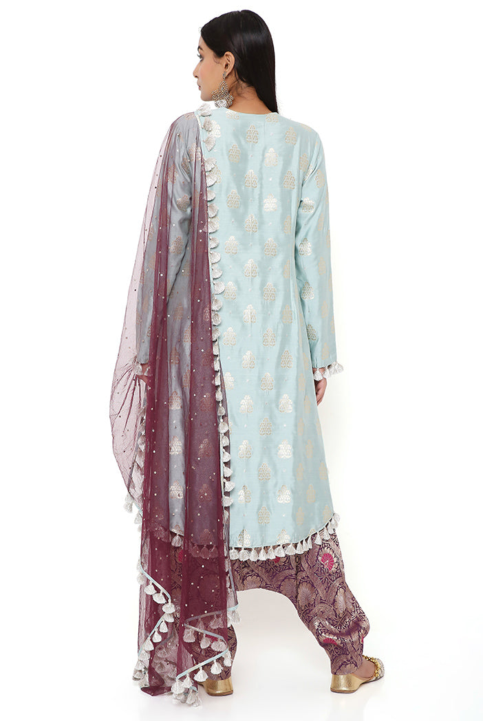 POWDER BLUE BROCADE SILK HIGH LOW KURTA WITH PURPLE BROCADE LOW CROTCH PANT AND PURPLE MUKAISH NET DUPATTA