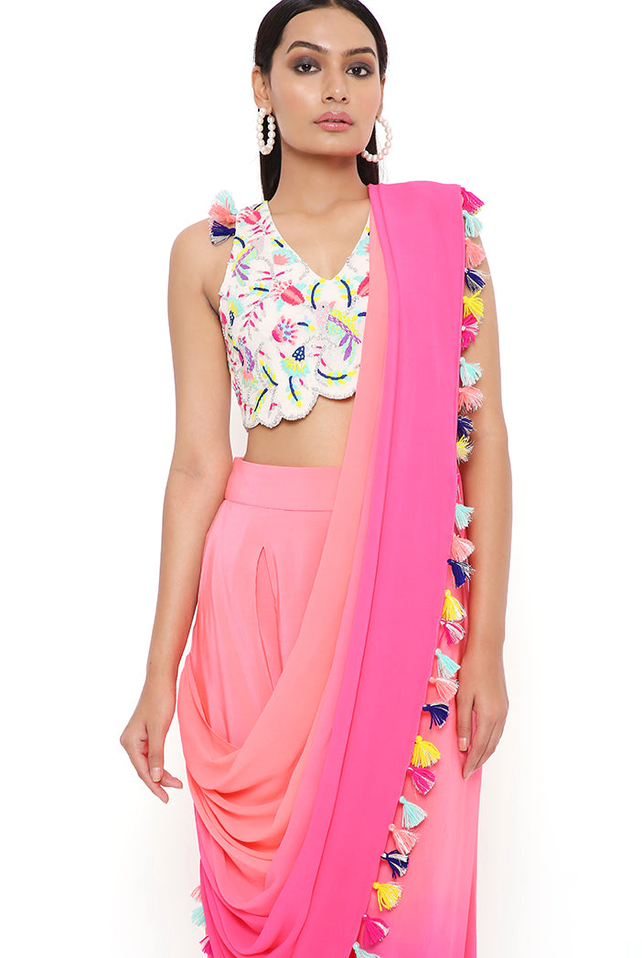 STONE GEORGETTE EMBROIDERED CHOLI WITH CORAL AND PINK CREPE SHADED LOW CROTCH AND GEORGETTE ATTACHED DRAPE