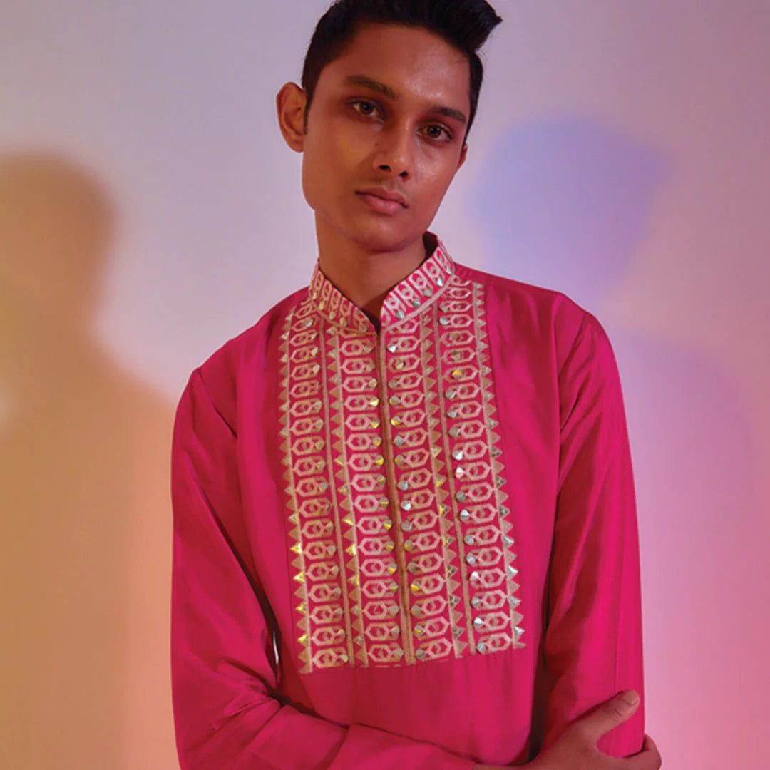 HOT PINK KURTA WITH EMBROIDERED YOKE TEAMED WITH IVORY PLEATED PANTS