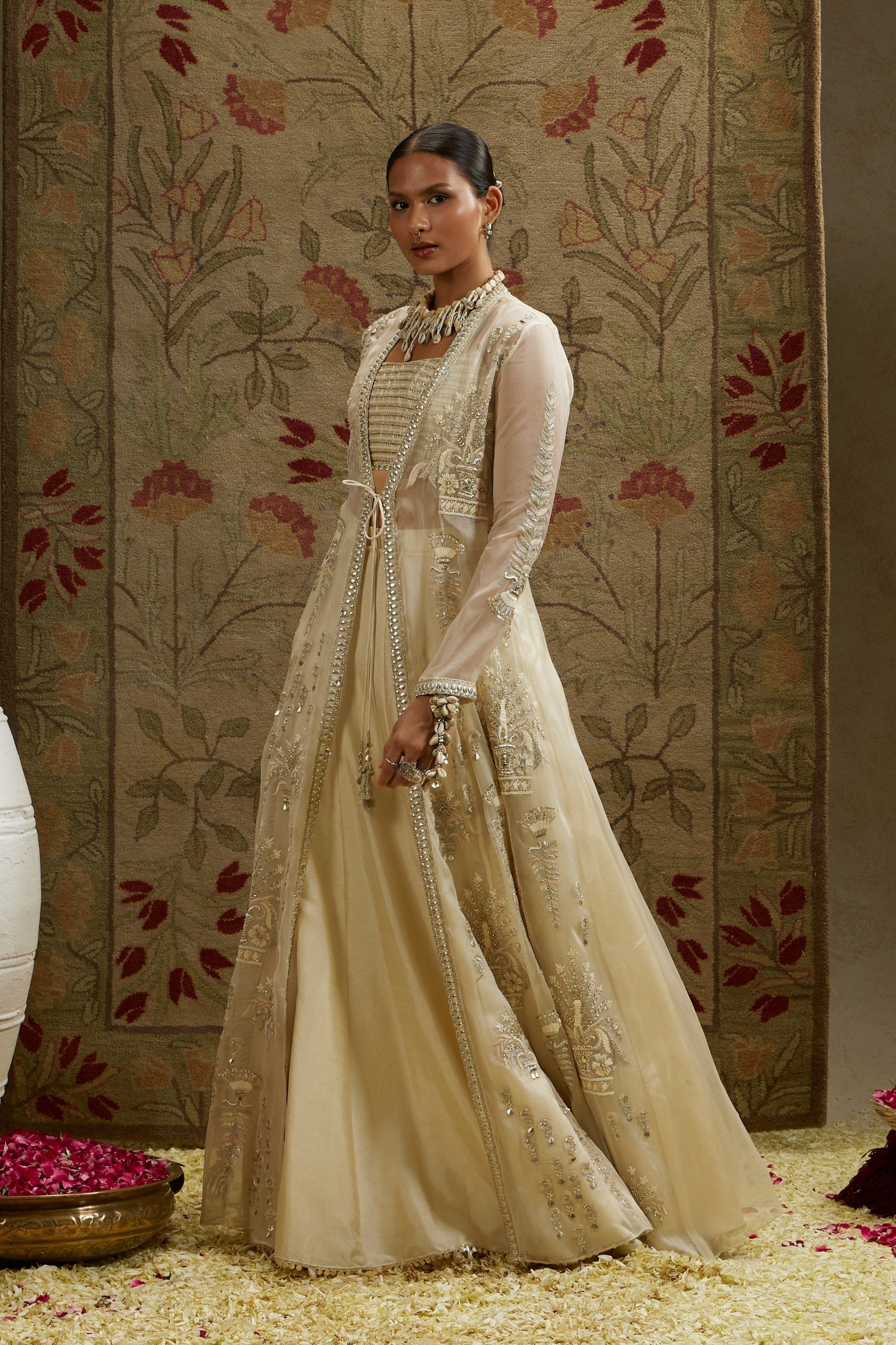 MAGNOLIA ORGANZA EMBELLISHED JACKET PAIRED WITH METAL BUSTIER AND LEHENGA