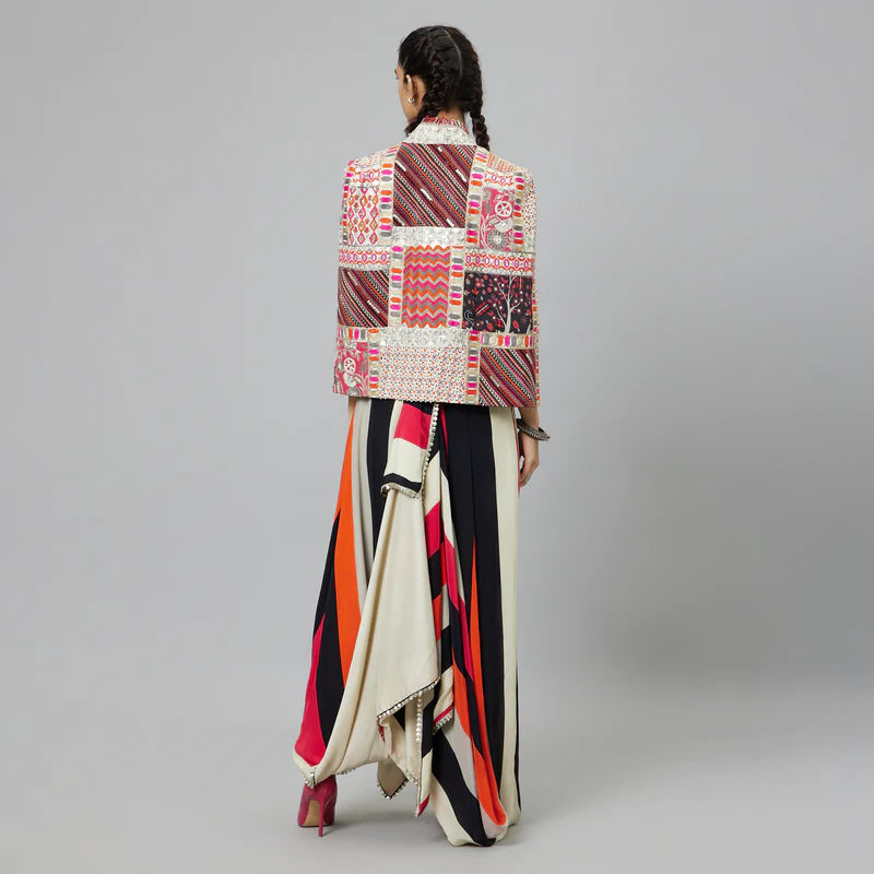 SHAHAR STRIPE PRINT NUSHRAT DRAPED SKIRT AND BUSTIER TEAMED WITH A SIGNATURE STRUCTURED JACKET