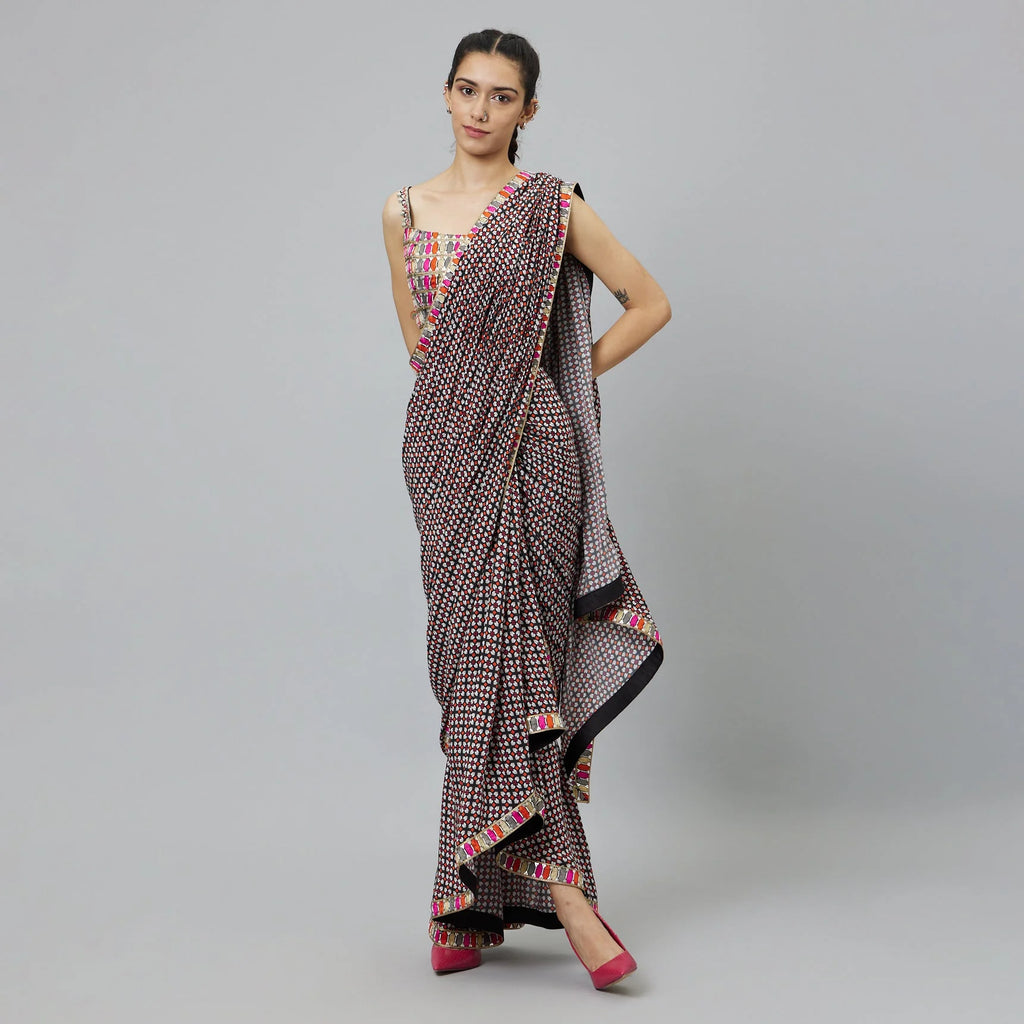 BLACK GEOMETRIC PRINT CASCASE SAREE TEAMED WITH EMBELLISHED BUSTIER