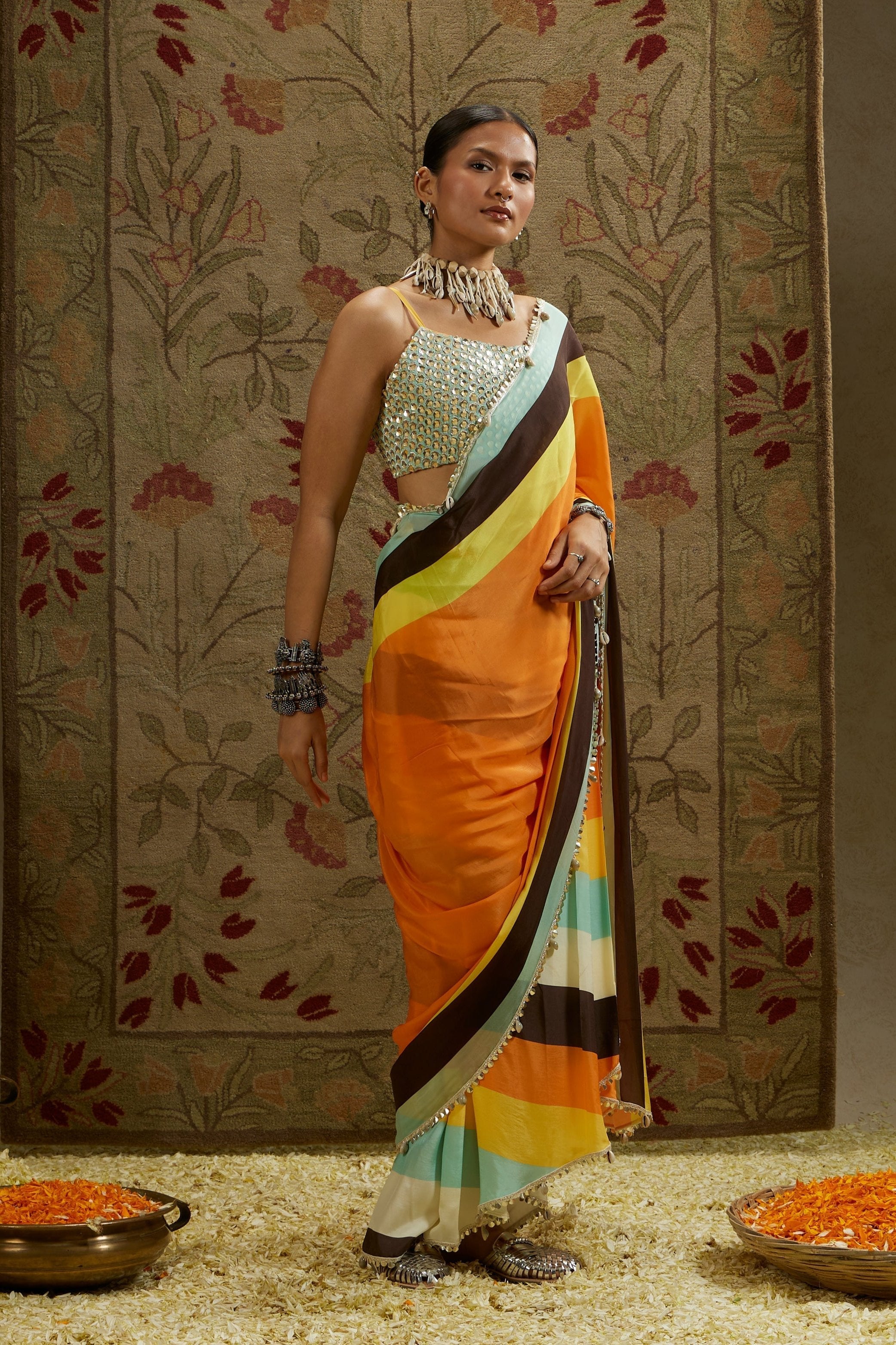 ORANGE MASK PRINT STRIPE PLEATED SAREE WITH METALLIC SCALLOP BUSTIER