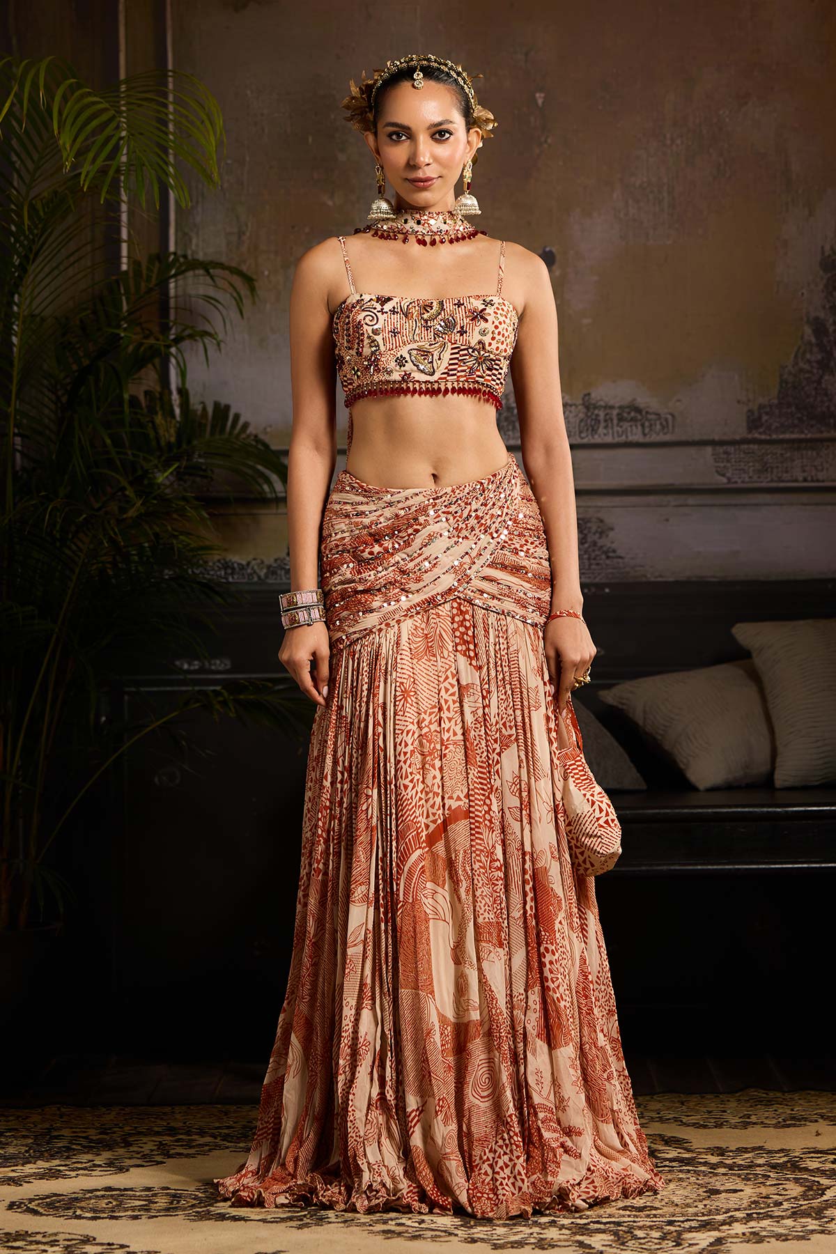 Nora Fatehi in Beige & Rust Print and Highlighted Lehenga Set