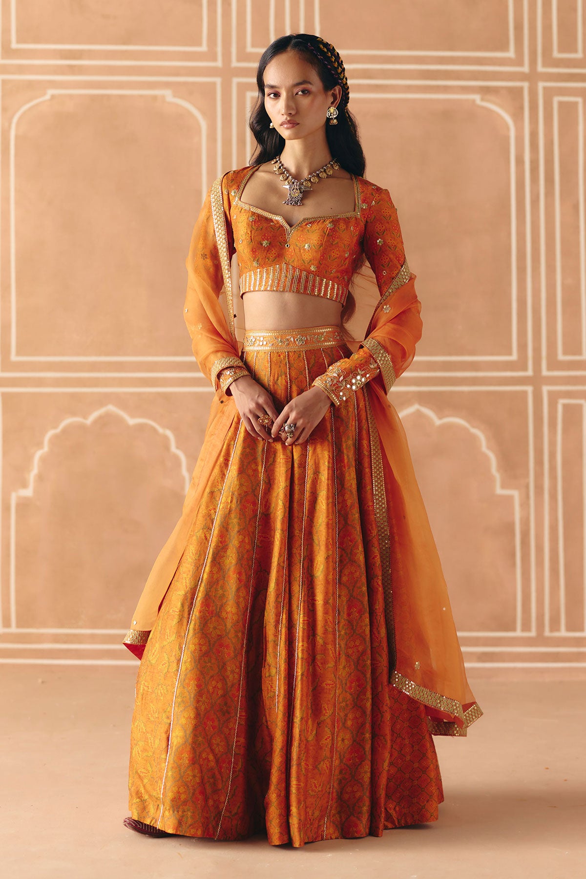 Burnt orange mix print panel lehenga