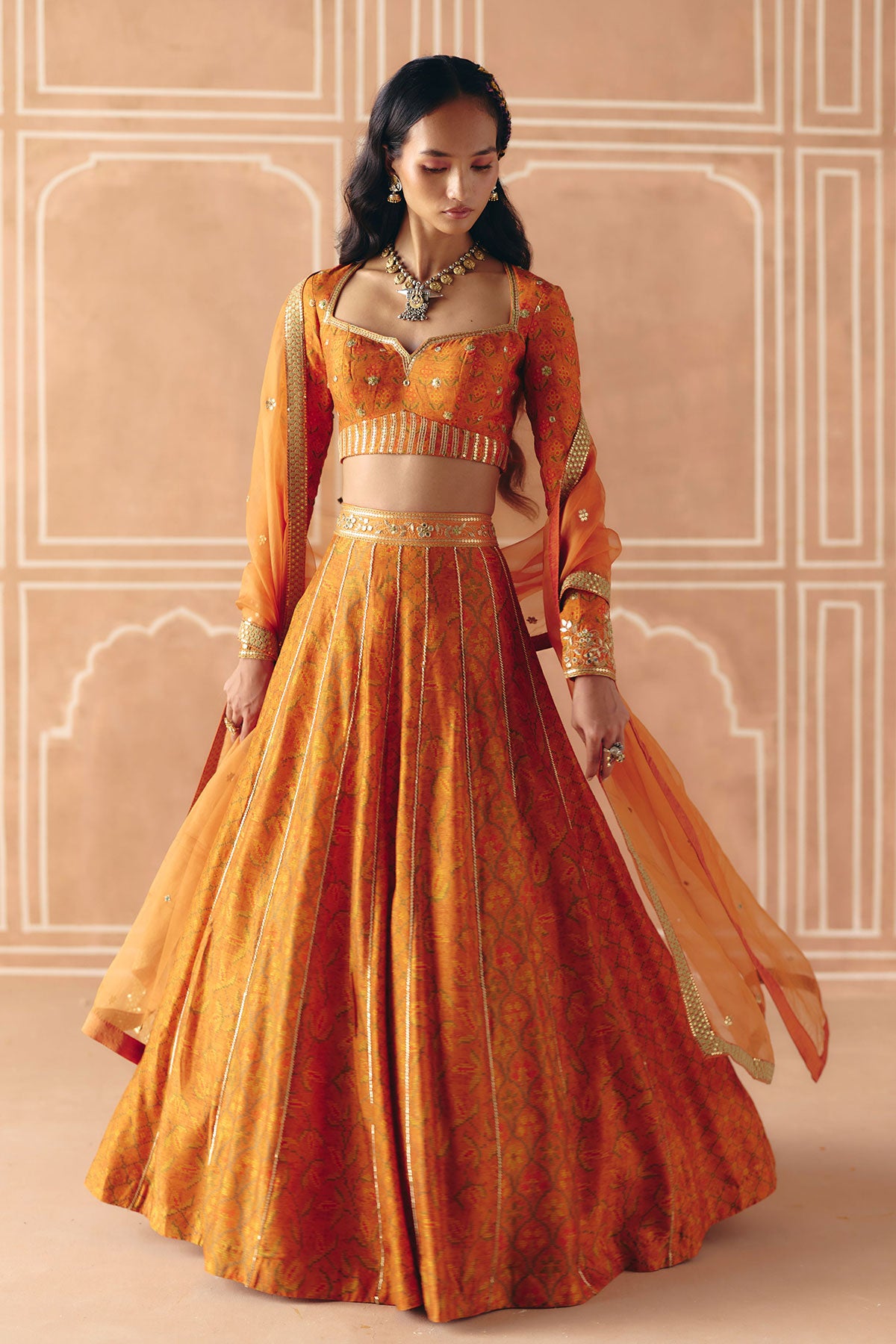 Burnt orange mix print panel lehenga