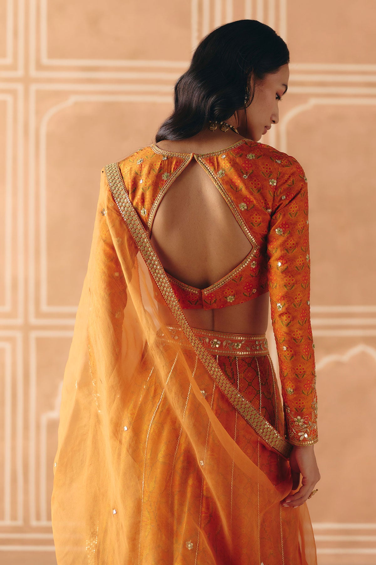 Burnt orange mix print panel lehenga