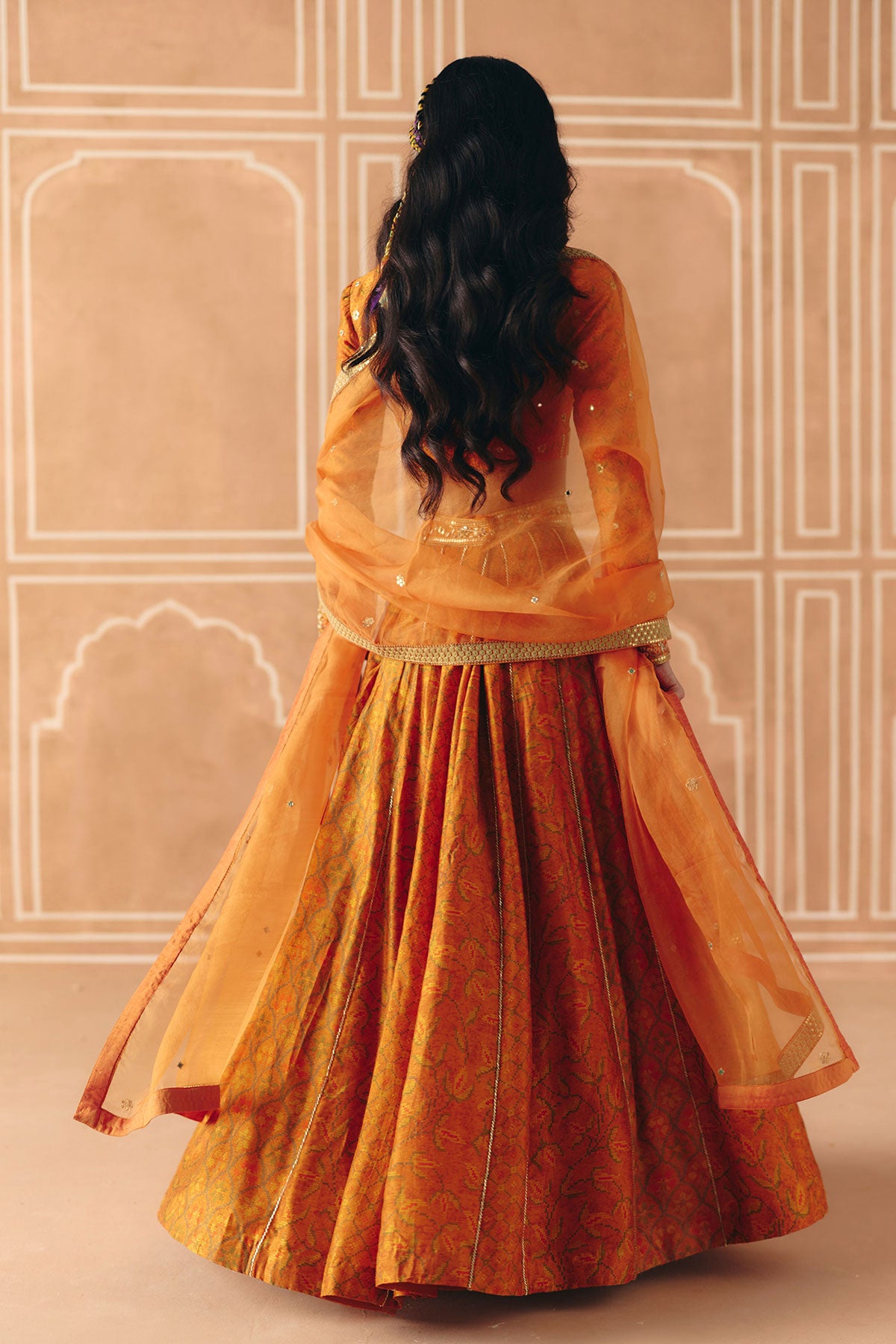 Burnt orange mix print panel lehenga