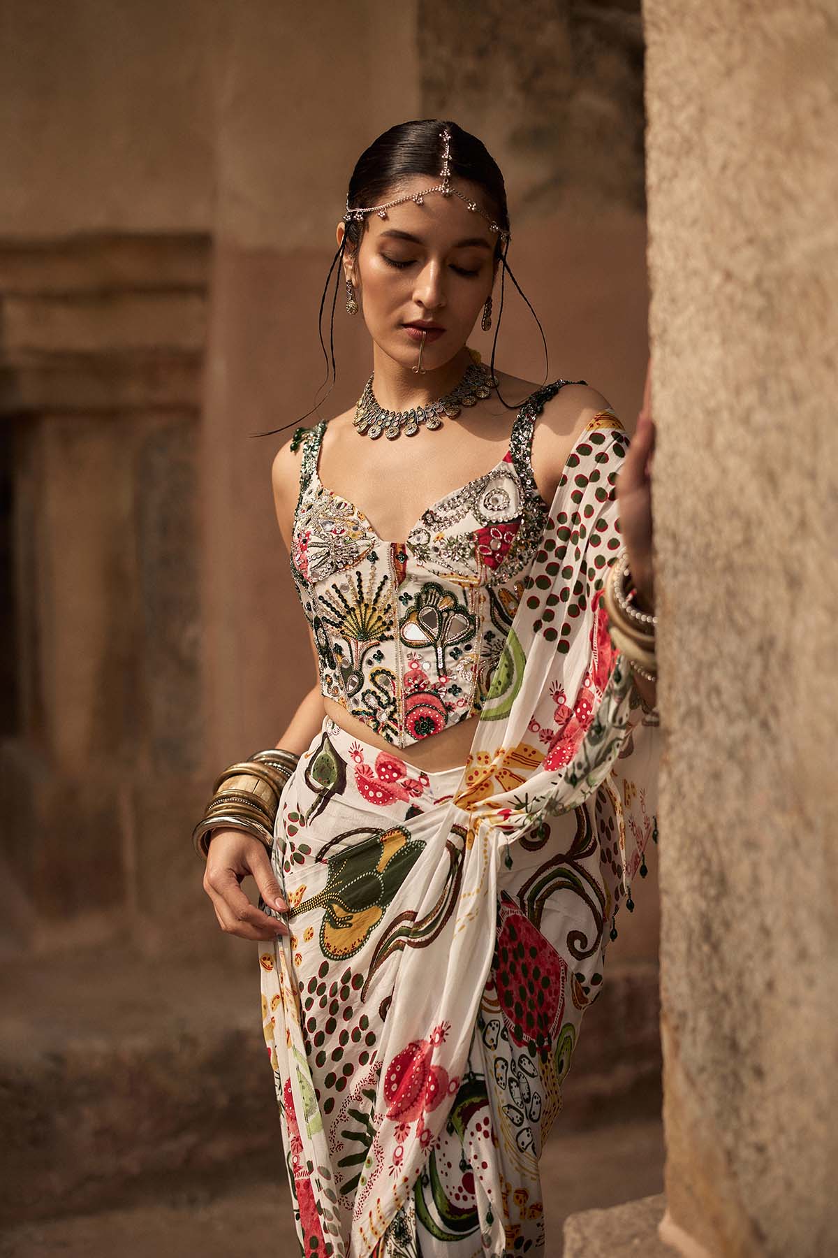 IVORY PRINT AND HIGHLIGHTED CORSET WITH  DHOTI SKIRT SAREE SET