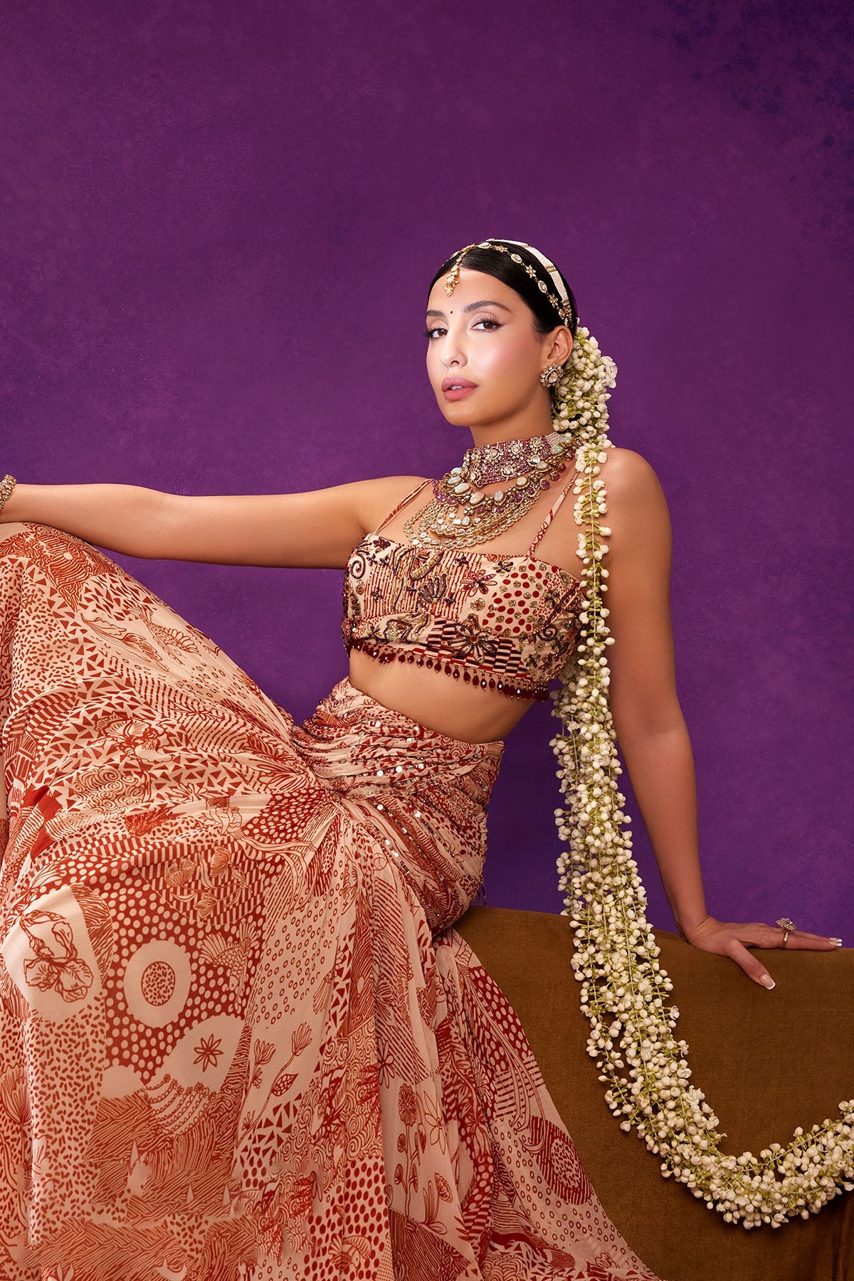 Nora Fatehi in Beige & Rust Print and Highlighted Lehenga Set