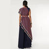 BLUE CROP TOP WITH ATTACHED DRAPE OF LEAF PRINT AND BLUE JAAL PRINT WITH BLUE SHARARA PANTS WITH EMB BELT