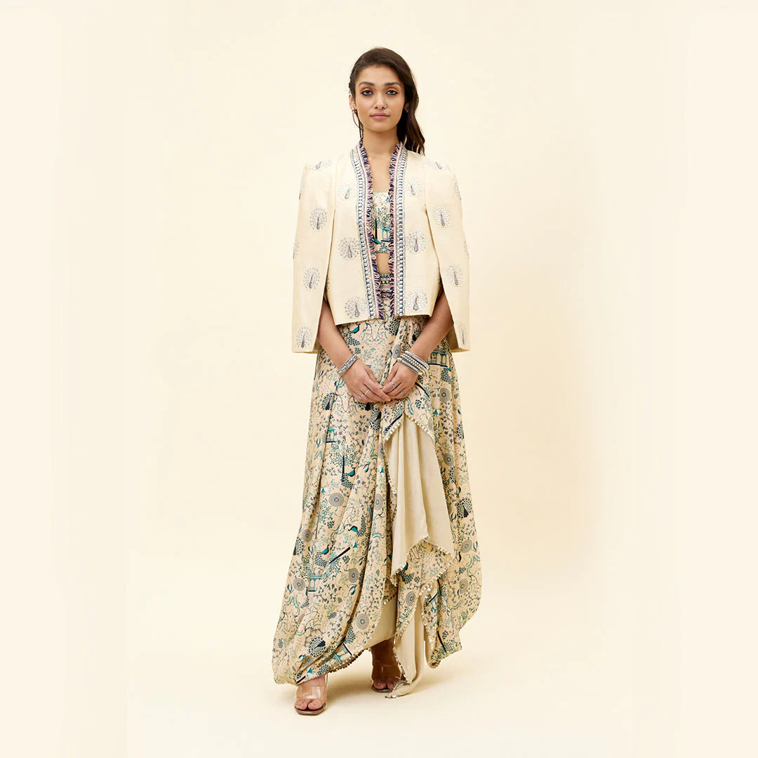 BEIGE MOR JAAL PRINT NUSRAT DRAPED SKIRT AND BUSTIER TEAMED WITH A SIGNATURE STRUCTURED CAPE JACKET