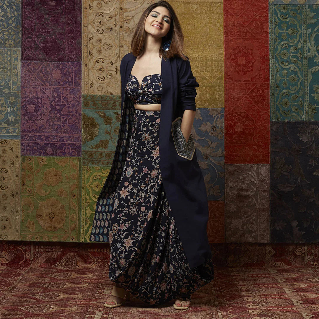 FLORAL PRINT DRAPE SKIRT PAIRED WITH PRINTED BIKINI BUSTIER AND DENIM JACKET WITH EMBELLISHED POCKET DETAILING