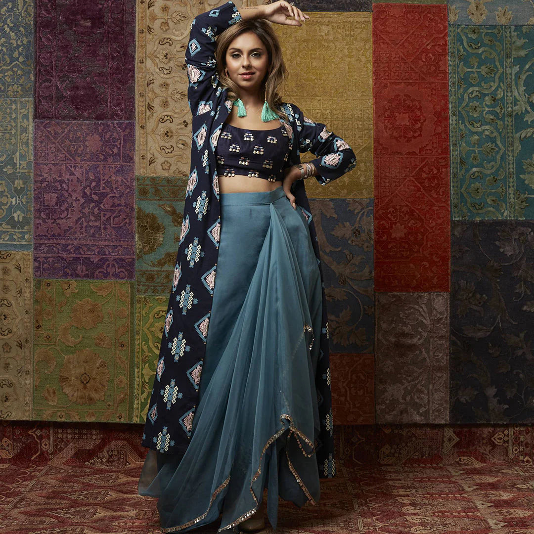 TEAL BLUE ORGANZA DRAPE SKIRT PAIRED WITH BUTTI EMBROIDERY AND A PRINTED DENIM JACKET