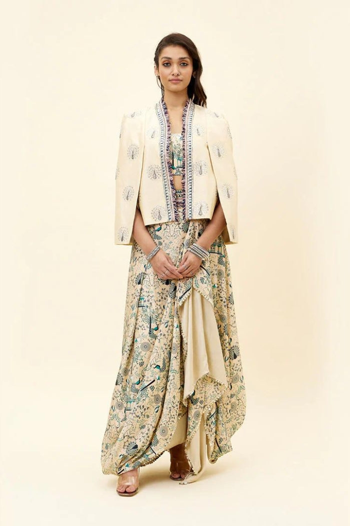 BEIGE MOR JAAL PRINT NUSRAT DRAPED SKIRT AND BUSTIER TEAMED WITH A SIGNATURE STRUCTURED CAPE JACKET