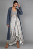 WHITE JAALI PRINT CHANDERI DRAPE SKIRT WITH PRINTED BUSTIER PAIRED WITH DENIM LASER CUT JACKET