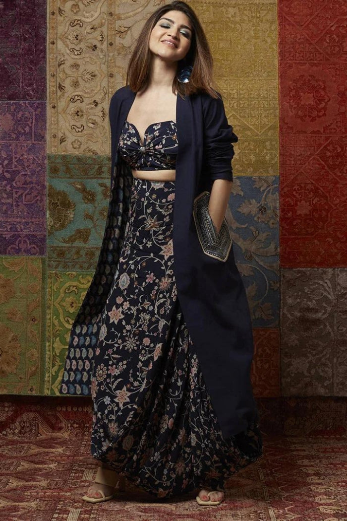 FLORAL PRINT DRAPE SKIRT PAIRED WITH PRINTED BIKINI BUSTIER AND DENIM JACKET WITH EMBELLISHED POCKET DETAILING