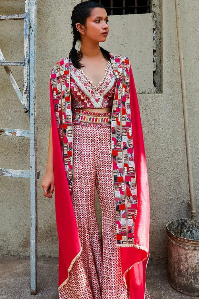 TEXTURED CROP TOP TEAMED WITH IVORY GEOMETRIC PRINT BOX PLEAT PANTS WITH EMBELLISHED CAPE