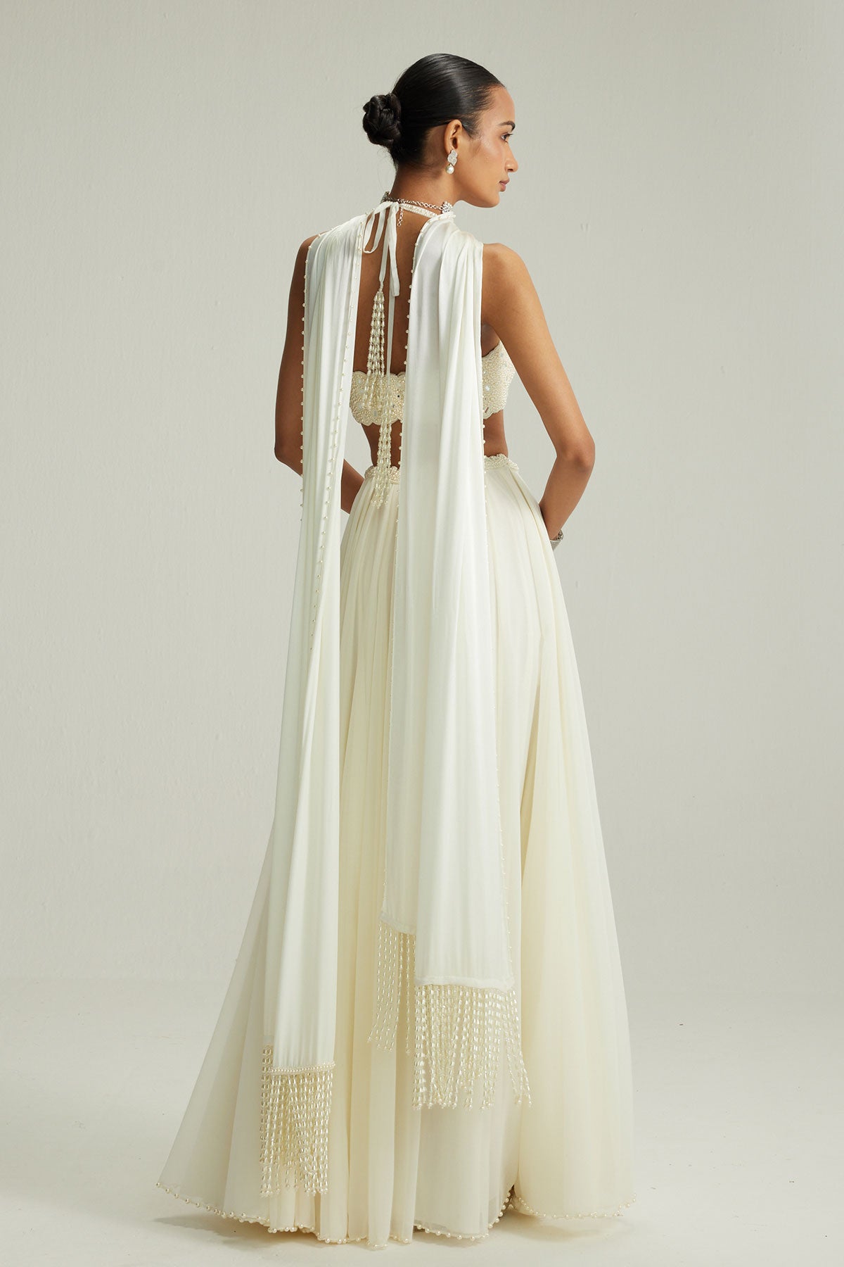 Off White Skirt Set With Halter Neck Blouse