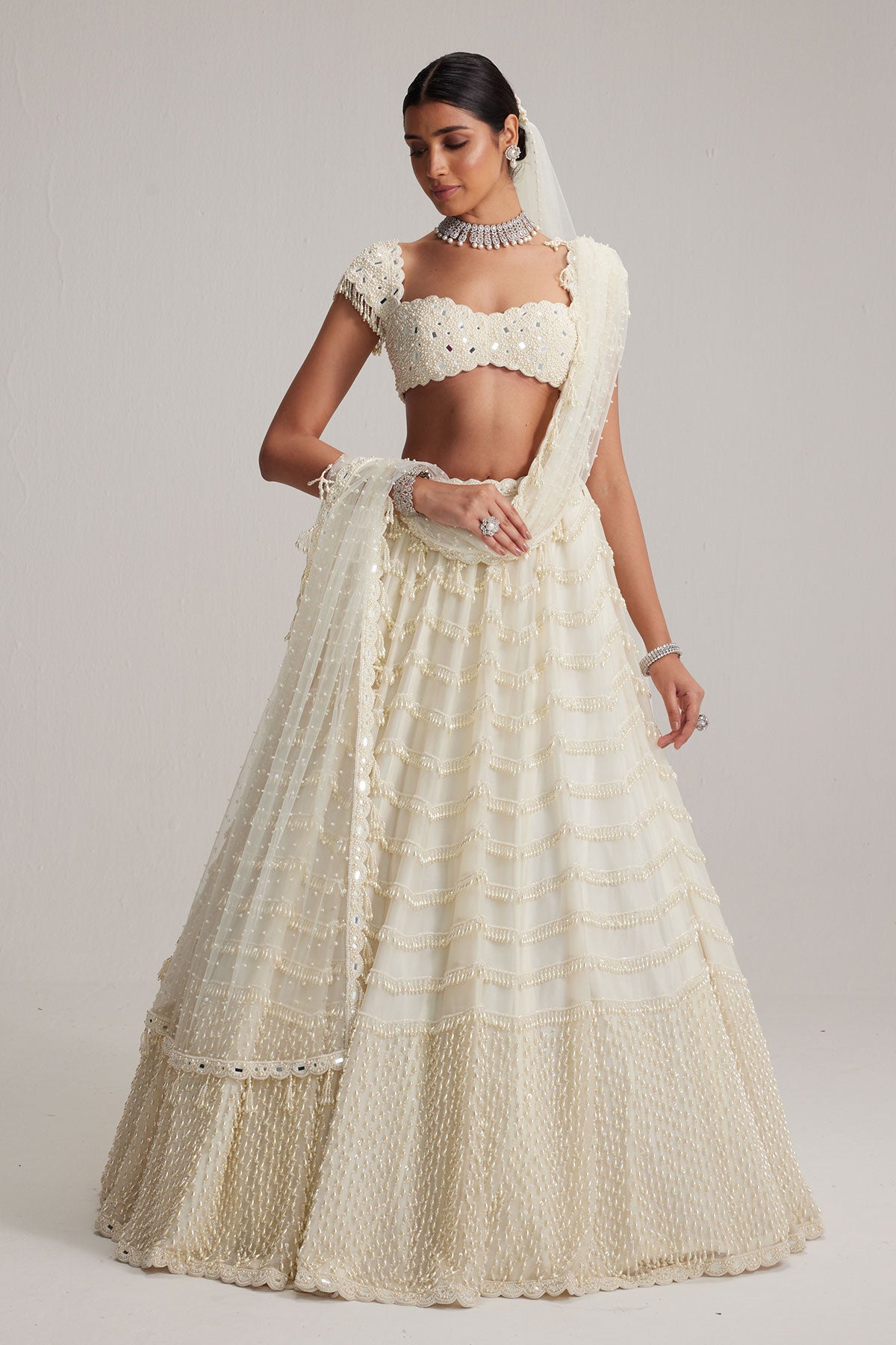 Off White Mirror and Pearl Drop Bridal lehenga set with Veil