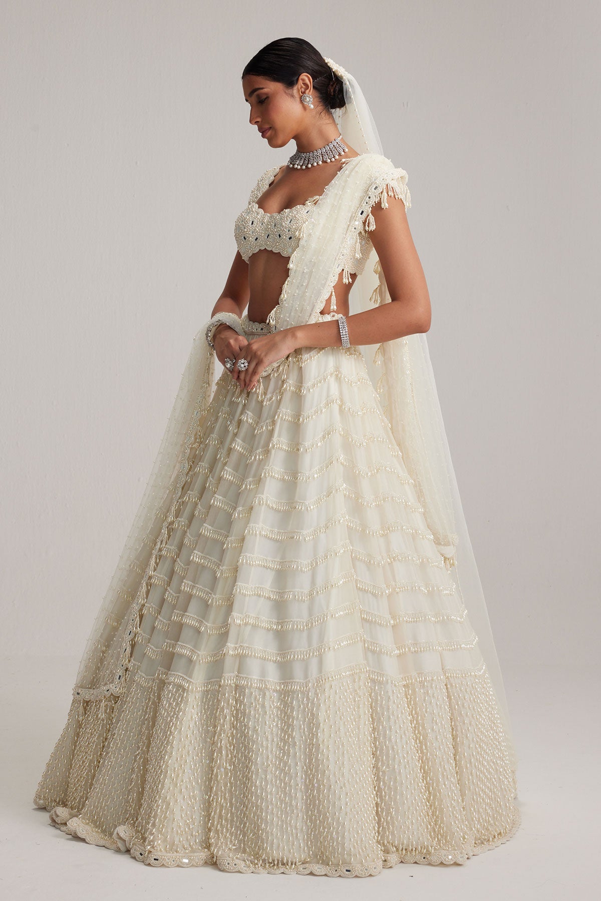 Off White Mirror and Pearl Drop Bridal lehenga set with Veil