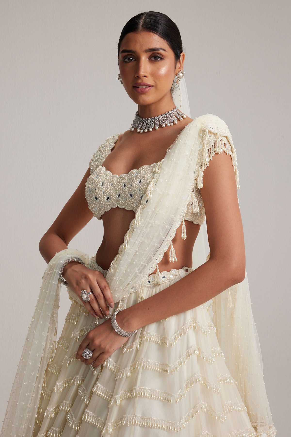Off White Mirror and Pearl Drop Bridal lehenga set with Veil
