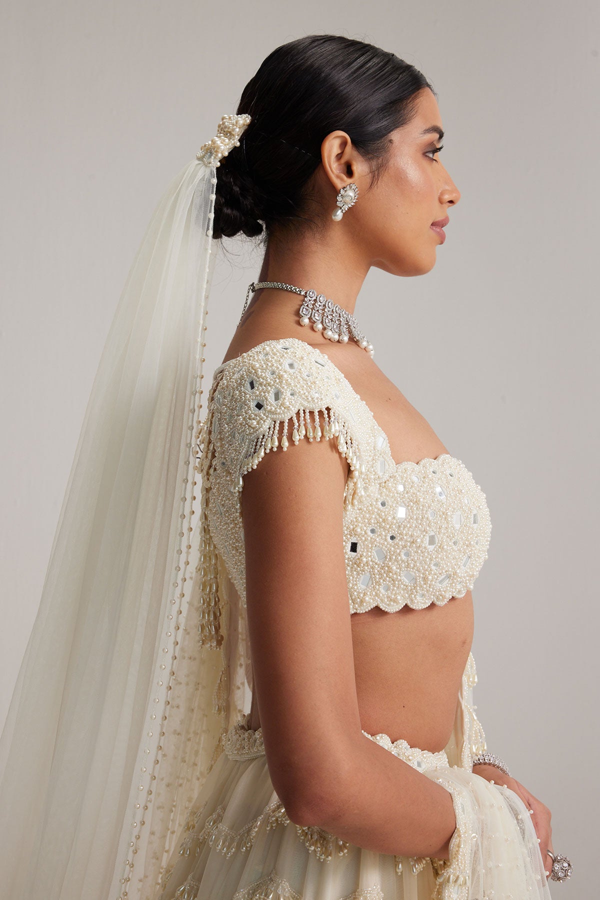 Off White Mirror and Pearl Drop Bridal lehenga set with Veil