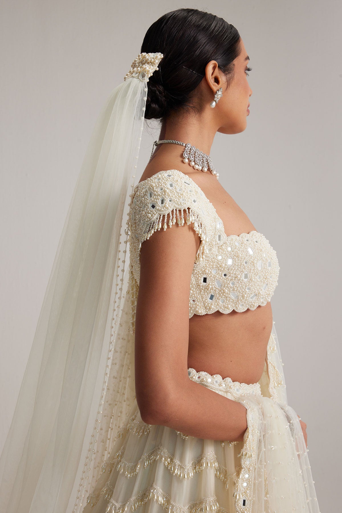 Off White Mirror and Pearl Drop Bridal lehenga set with Veil