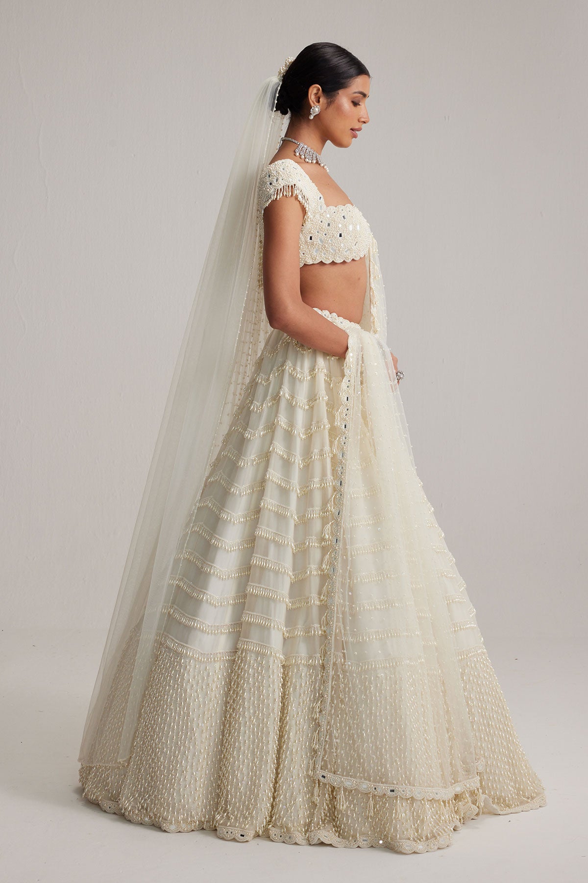 Off White Mirror and Pearl Drop Bridal lehenga set with Veil