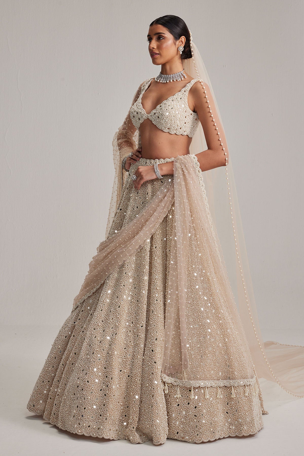 Light Beige Dense mirror and pearl lehenga set with Double Dupatta and Veil