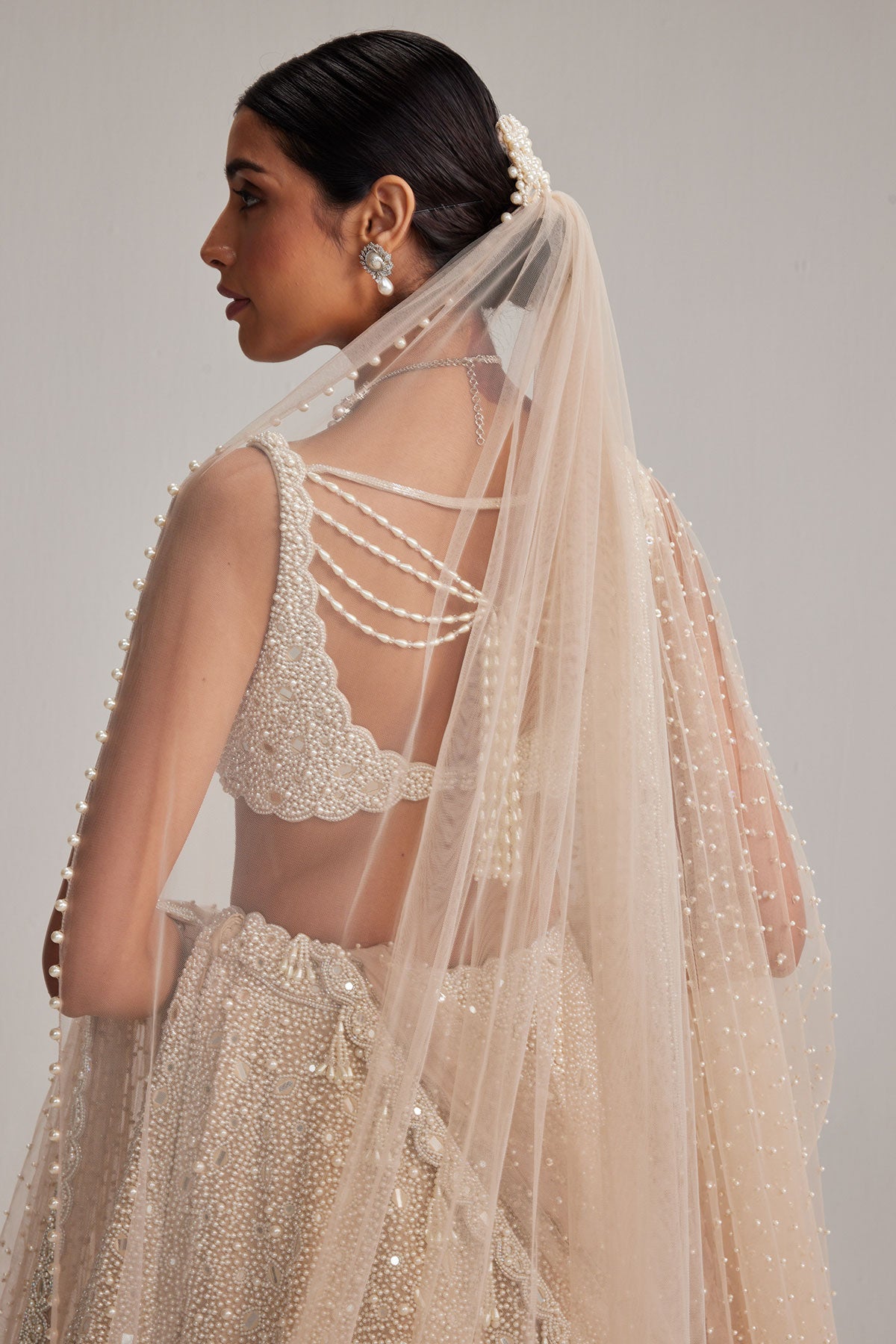 Light Beige Dense mirror and pearl lehenga set with Double Dupatta and Veil
