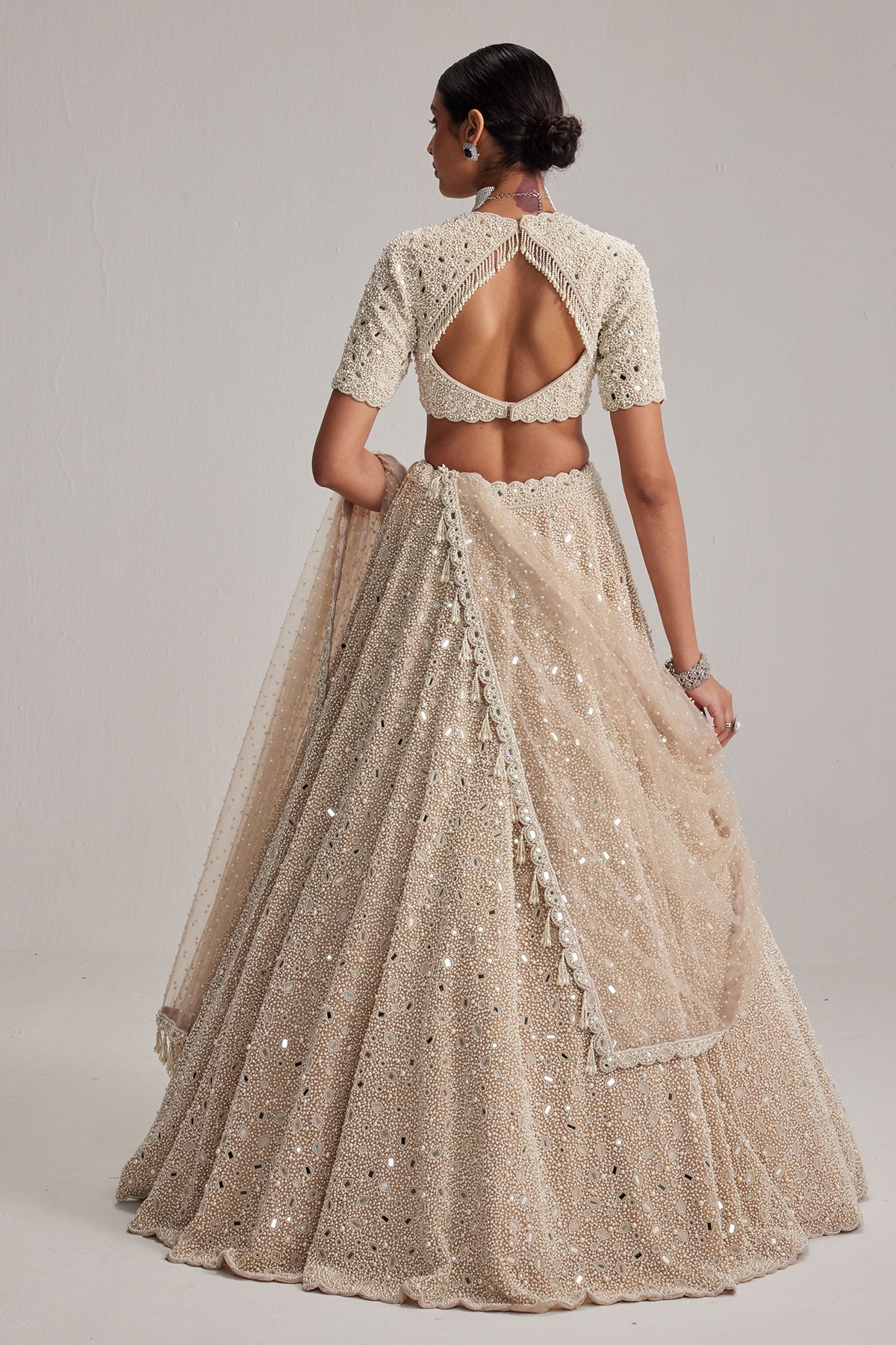 Light Beige Dense mirror and pearl lehenga set with High neck Blouse and Dupatta