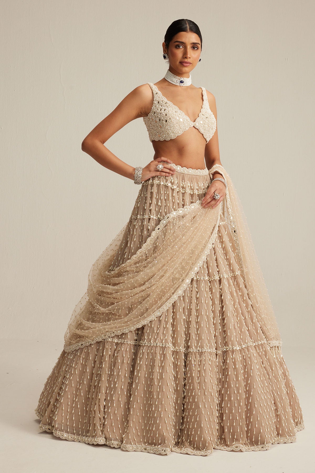 Light Beige Pearl Drop Multi Tier Lehenga Set.