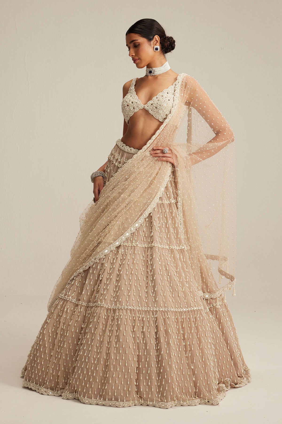 Light Beige Pearl Drop Multi Tier Lehenga Set.