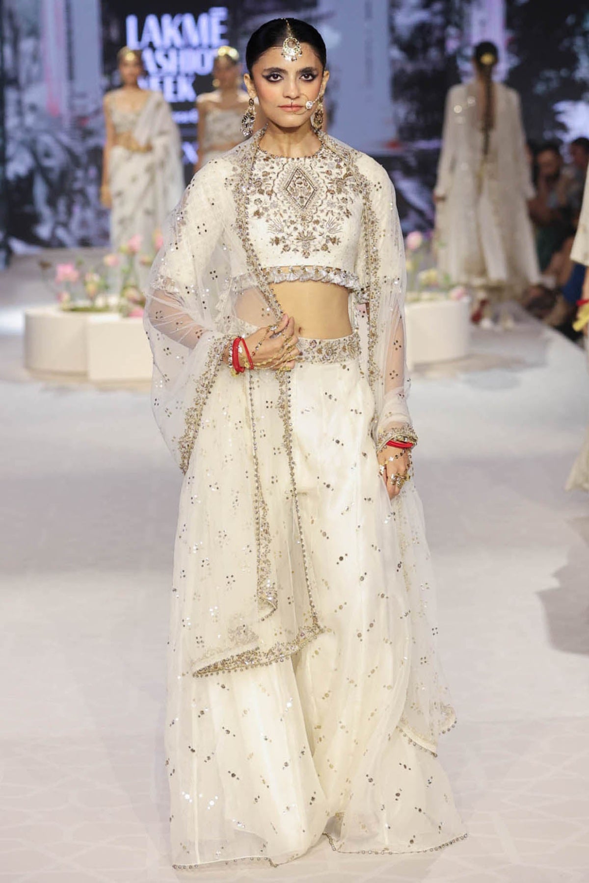 Shakira Off White Embroidered High Low Choli With Sharara And Dupatta