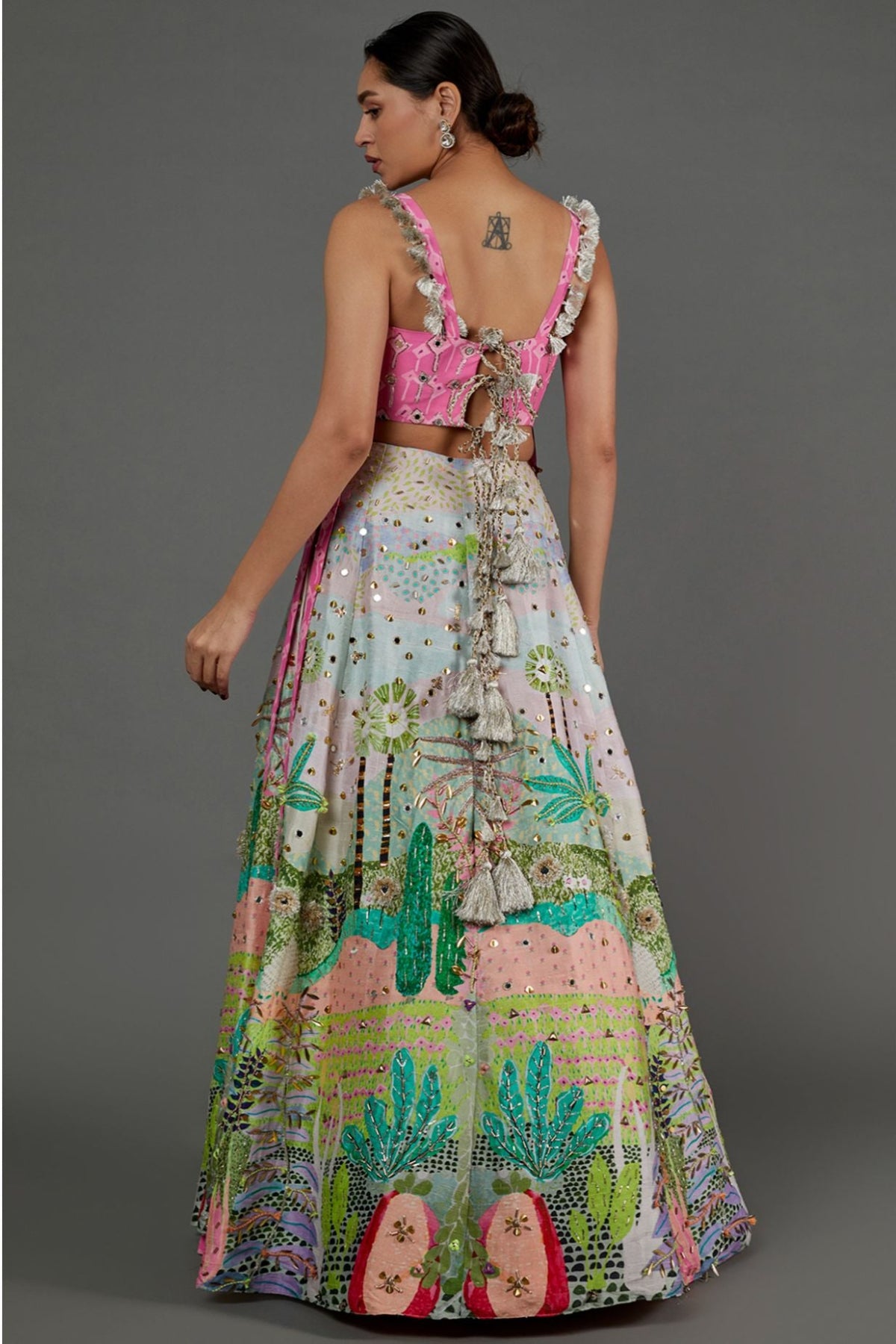 PINK KITE PRINT GEORGETTE EMBROIDERED BUSTIER AND TROPICAL PRINT DUPION SILK EMBROIDERED LEHENGA WITH PINK MUKAISH NET DUPATTA