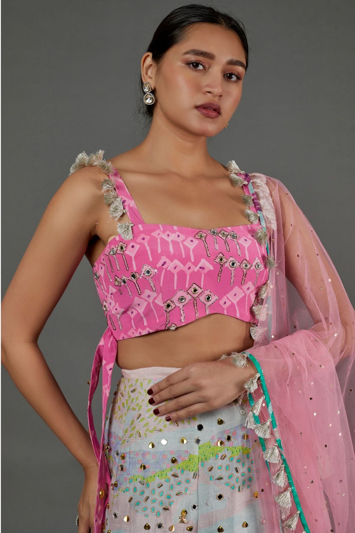 PINK KITE PRINT GEORGETTE EMBROIDERED BUSTIER AND TROPICAL PRINT DUPION SILK EMBROIDERED LEHENGA WITH PINK MUKAISH NET DUPATTA