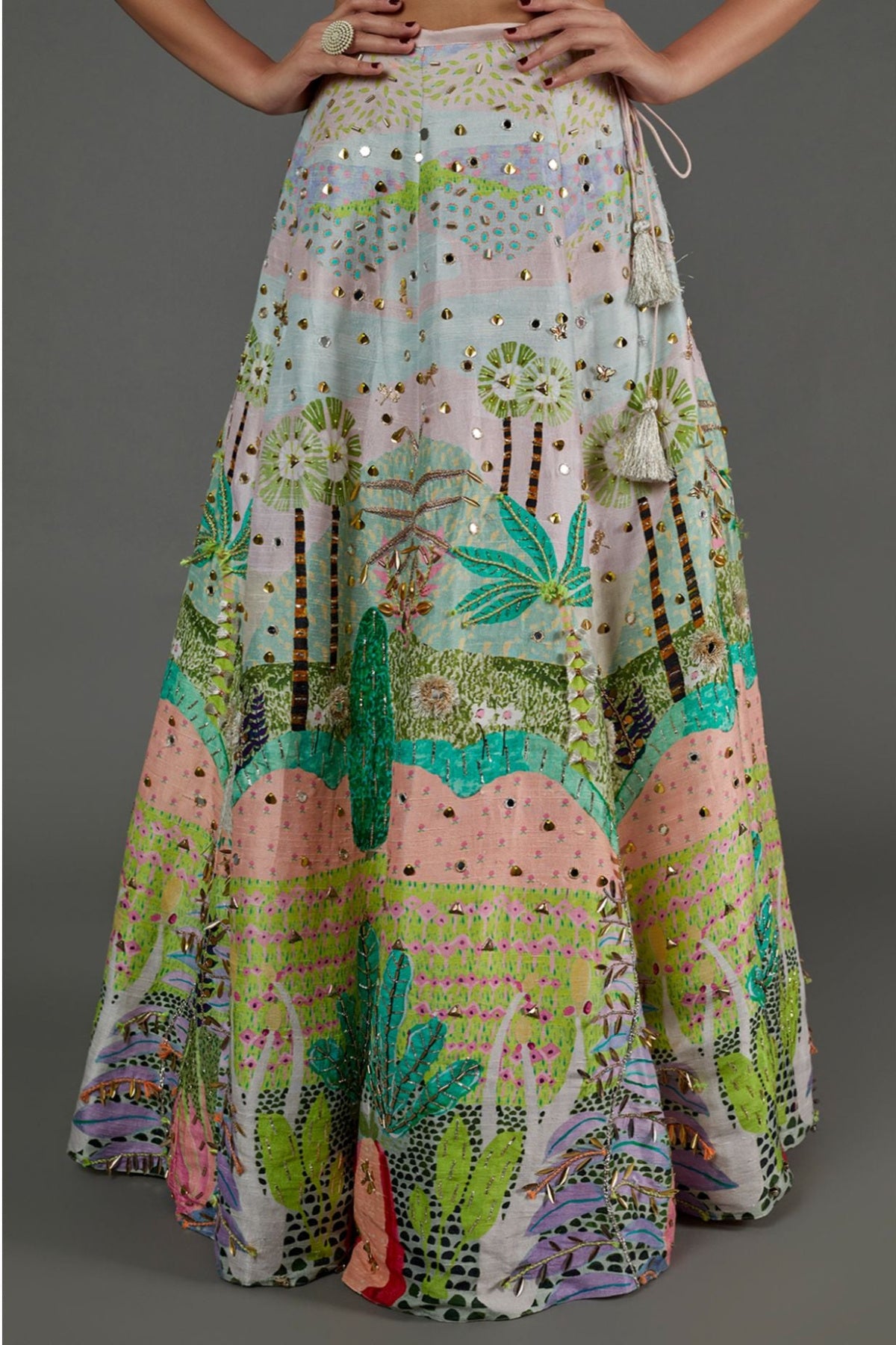 PINK KITE PRINT GEORGETTE EMBROIDERED BUSTIER AND TROPICAL PRINT DUPION SILK EMBROIDERED LEHENGA WITH PINK MUKAISH NET DUPATTA