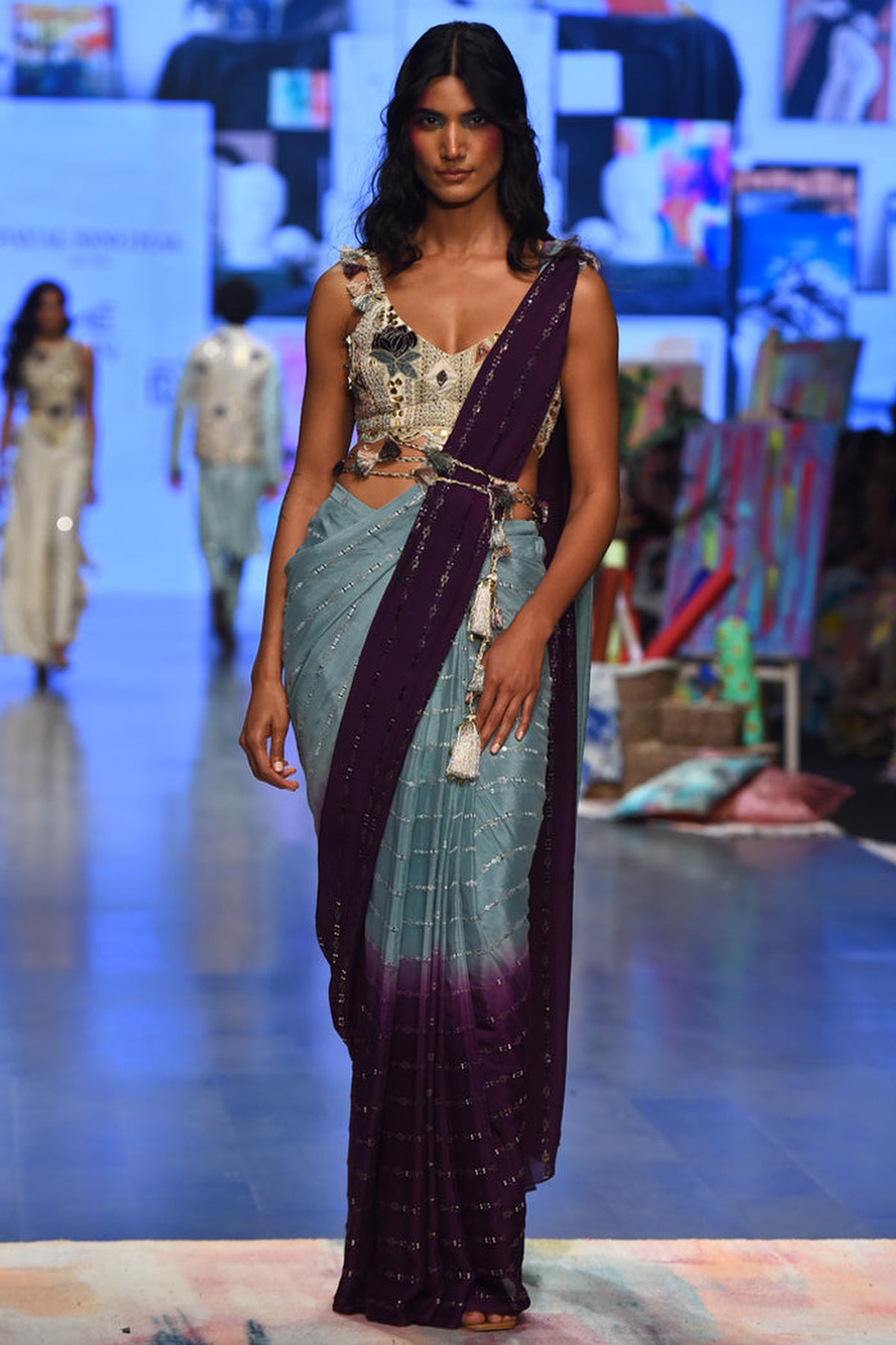 NIYA OFF WHITE GEORGETTE EMBROIDERED CHOLI WITH POWDER BLUE AND PURPLE GEORGETTE SEQUINS SAREE