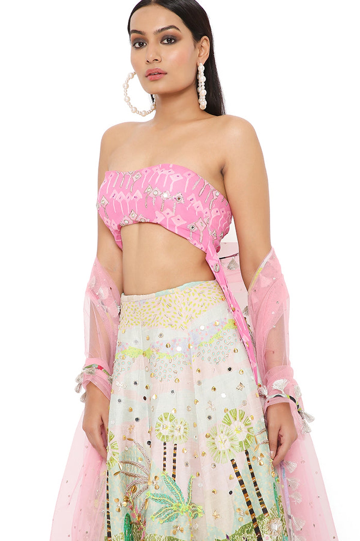 IVANA PINK KITE PRINT EMBROIDERED BUSTIER WITH TROPICAL PRINT EMBROIDERED LEHENGA AND MUKAISH NET DUPATTA