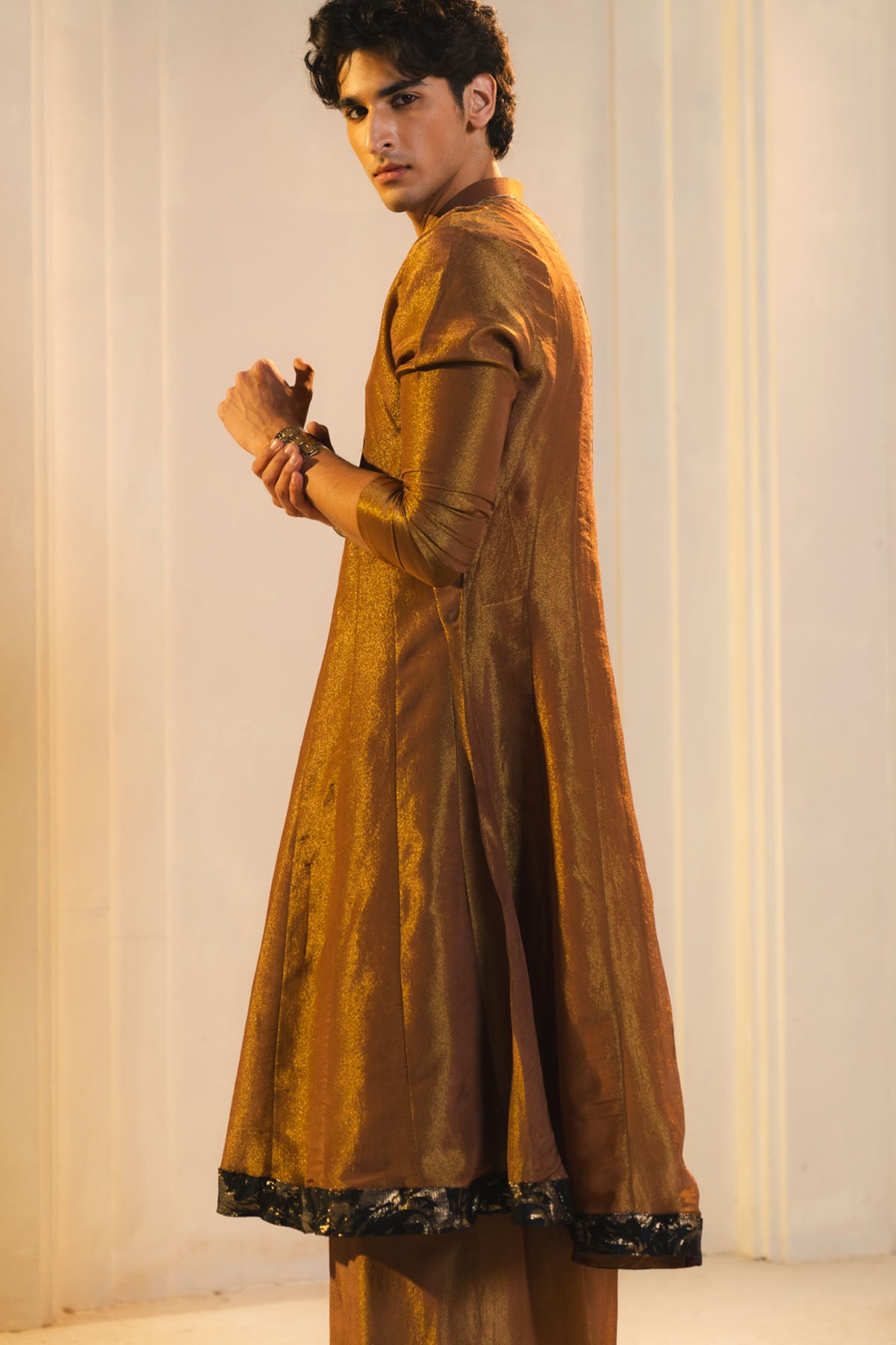 Anarkali Kurta In Gold, Paired With Flared Trousers.