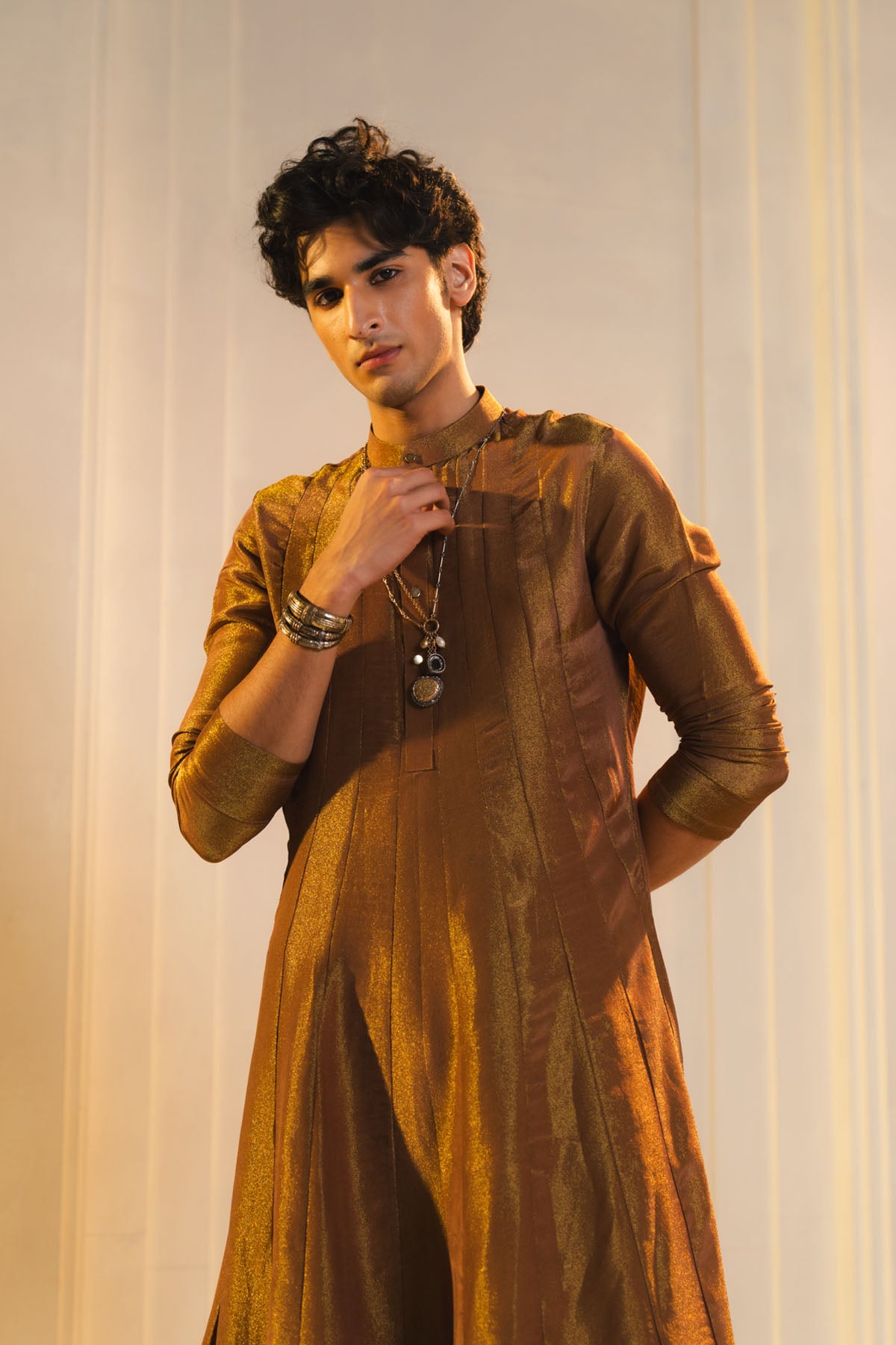 Anarkali Kurta In Gold, Paired With Flared Trousers.