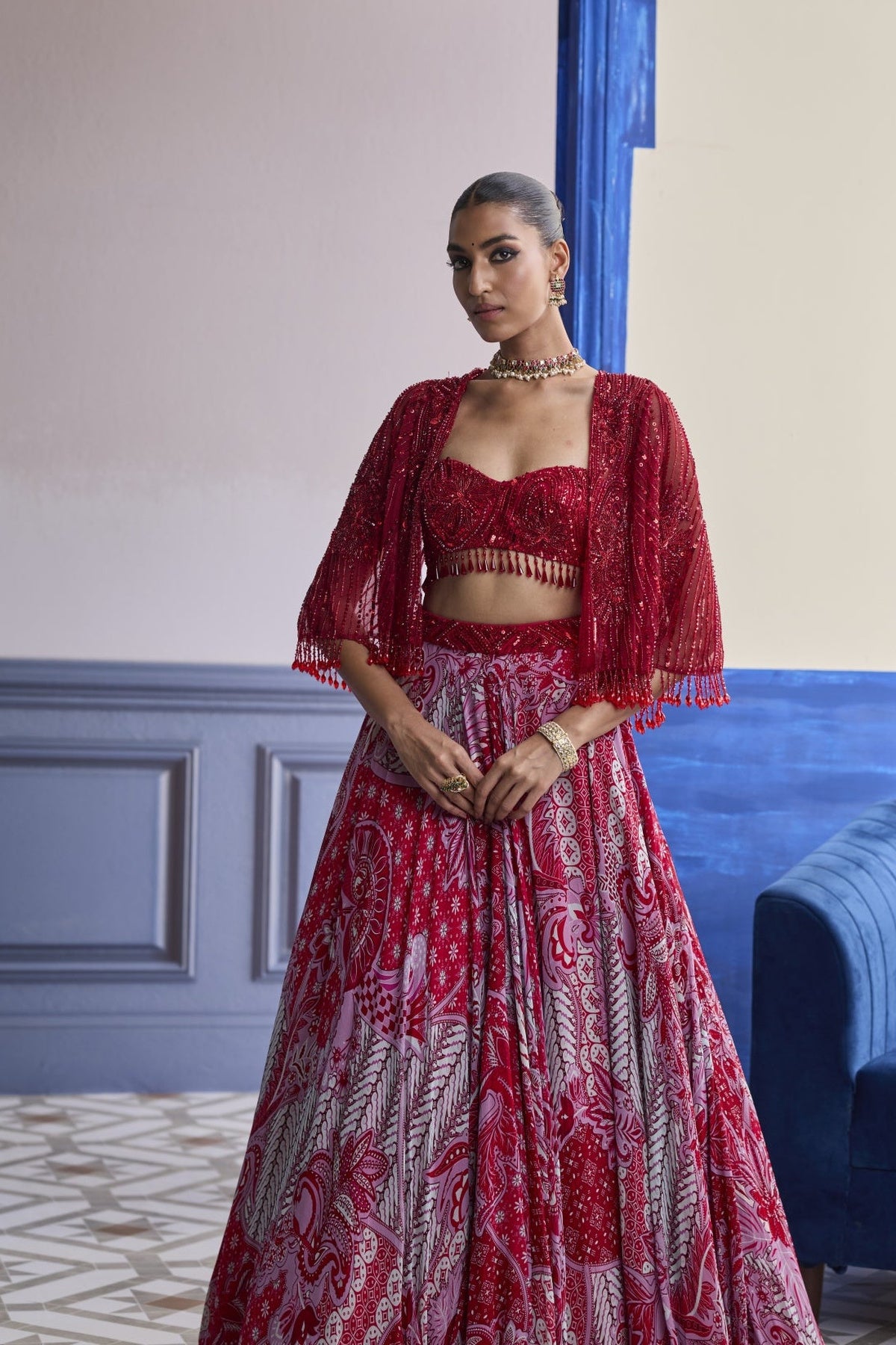 Red Embroidered Blouse With Tassel Cape Jacket & Floral Lehenga Set