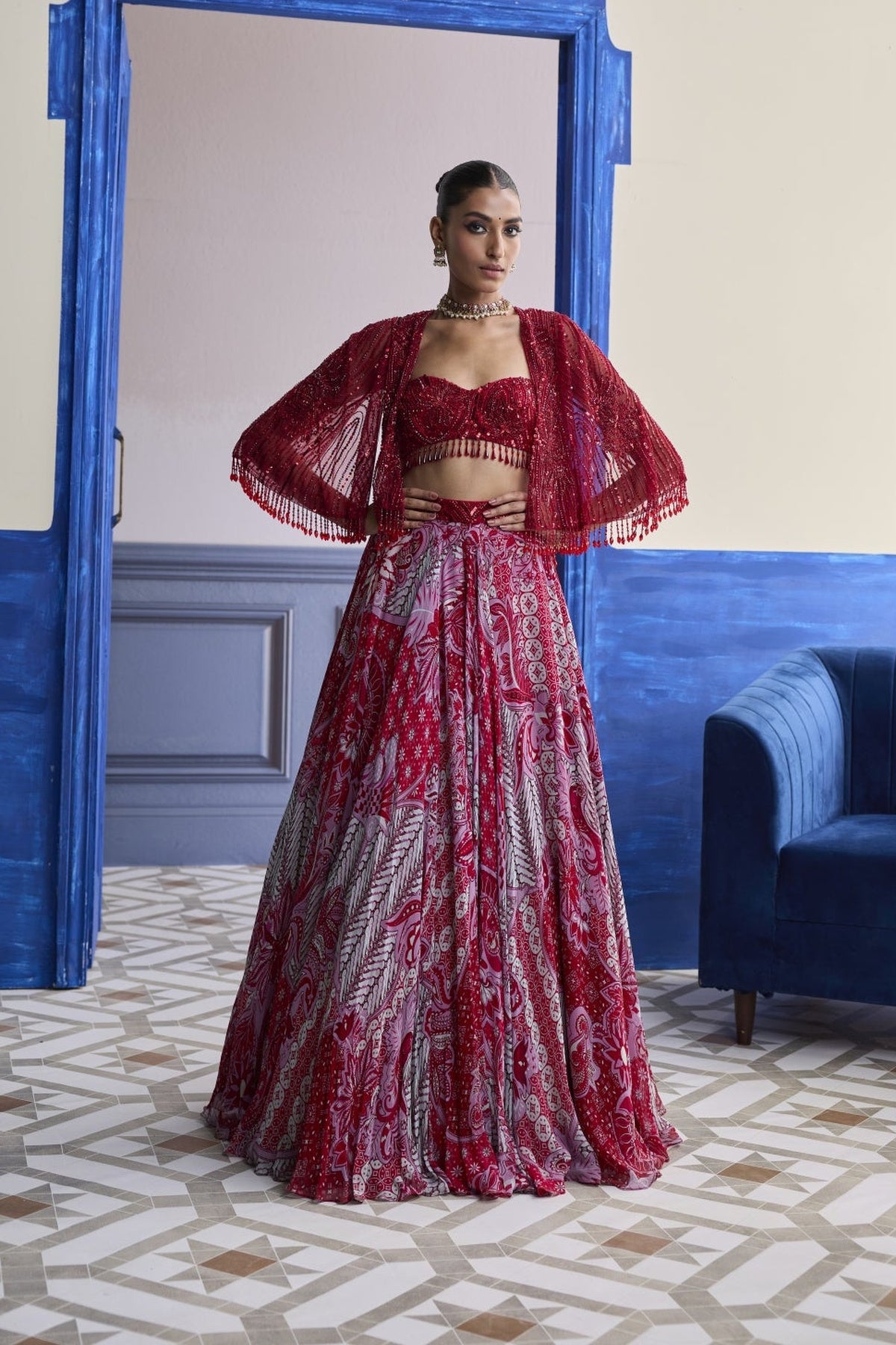 Red Embroidered Blouse With Tassel Cape Jacket & Floral Lehenga Set