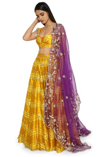 Daksha Mustard Colour Leheriya Silk Bustier With Embroidered Lehenga And Purple Organza Dupatta