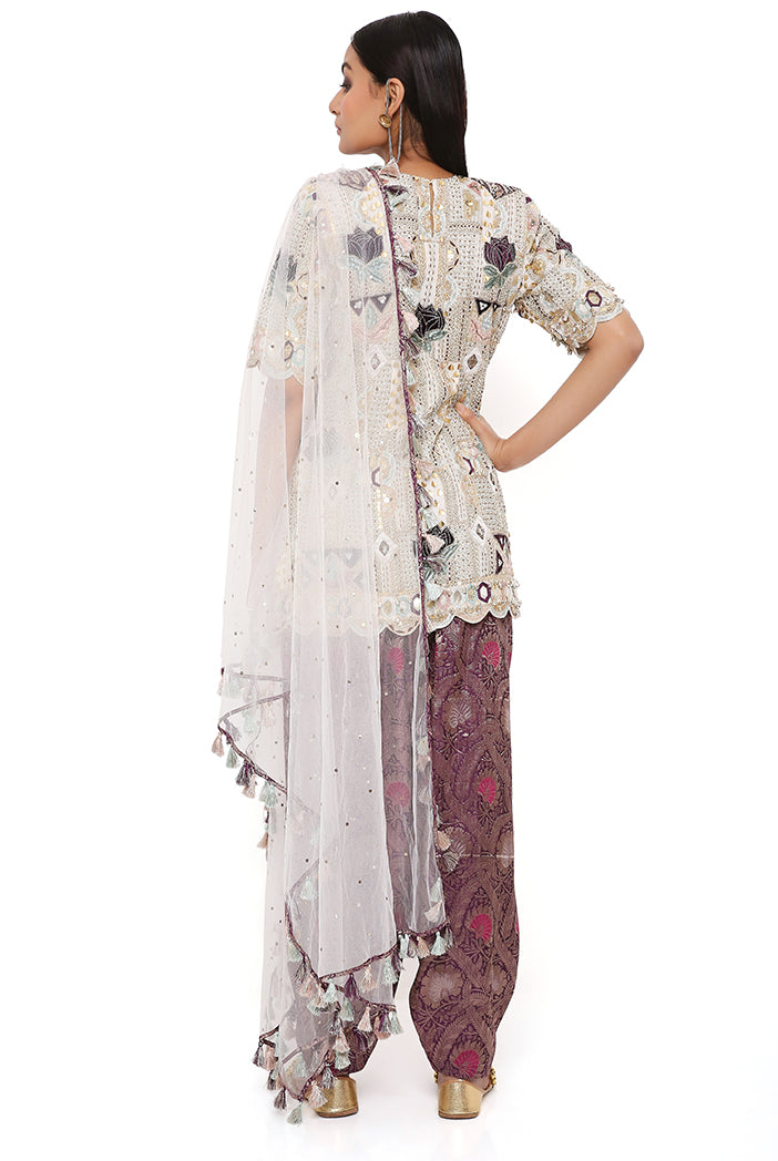 OFF WHITE GEORGETTE EMBROIDERED KURTA WITH PURPLE BROCADE SALWAR AND OFF WHITE MUKAISH NET DUPATTA